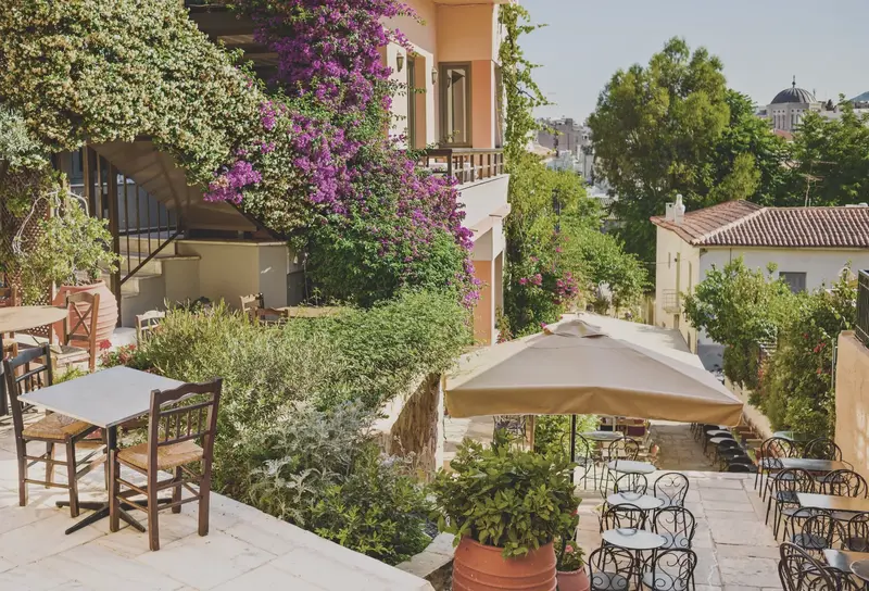 Charming streets of Plaka neighborhood in Athens with bougainvillea flowers